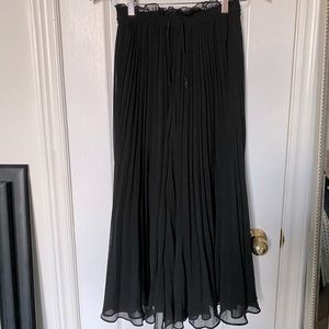 Black pleated wide legged pants